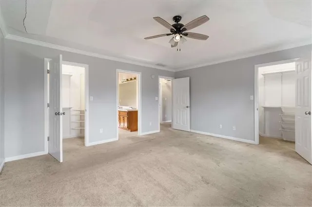 a view of an empty room with a bathroom