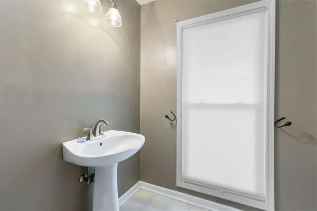 a bathroom with a sink and mirror