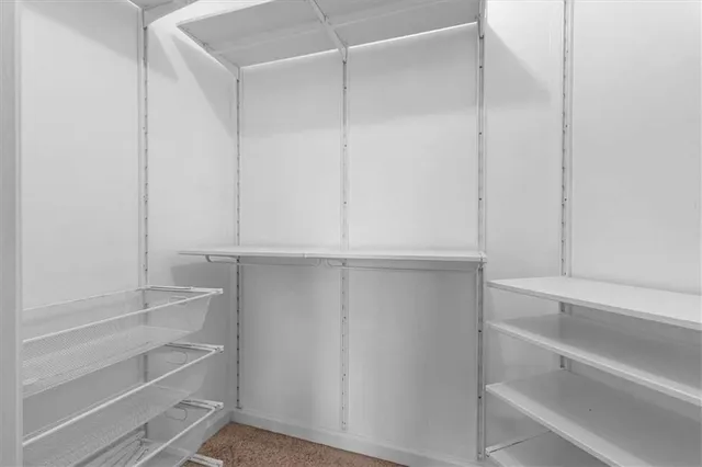 a view of an empty walk in closet