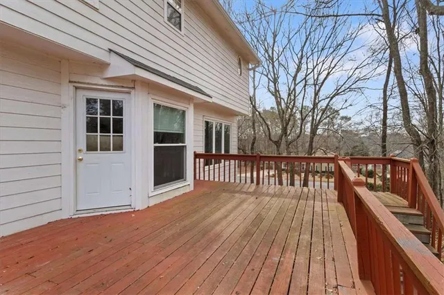a view of wooden deck and a trees