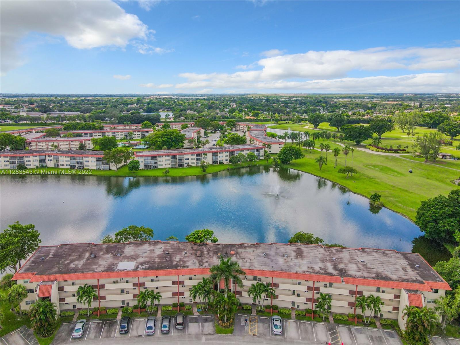 an aerial view of lake residential houses with outdoor space and lake view