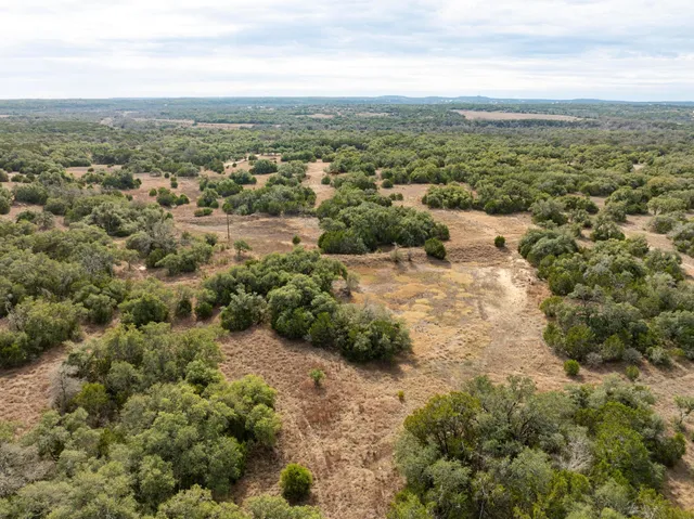 a view of a lake with houses in the back