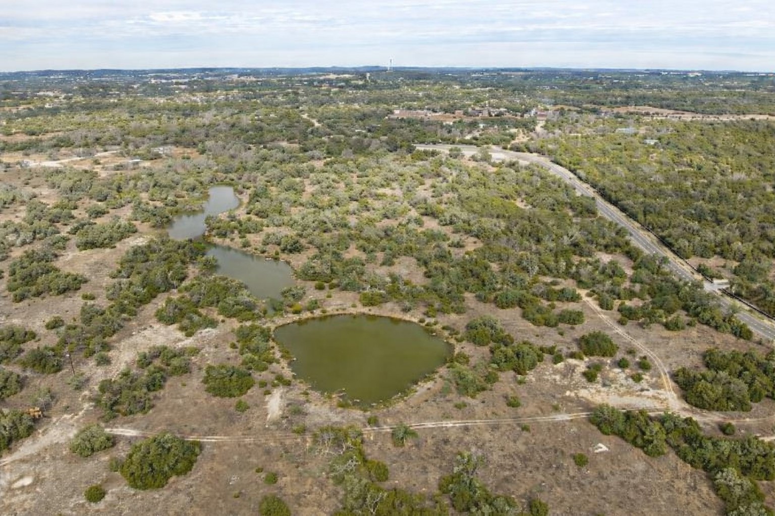 150 West Rte Driftwood Tx 78619 Route Driftwood, TX 78619 - Photo 34 of 34 Enhanced using AI for ponds which are dry due to drought