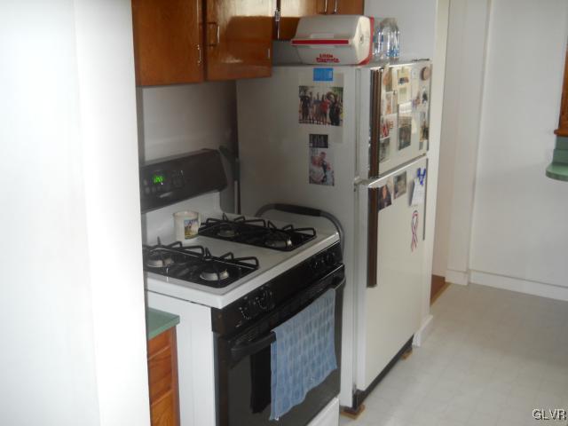 8368 Airport Road Bath, PA 18014 - Photo 2 of 10 a kitchen with a stove and a refrigerator