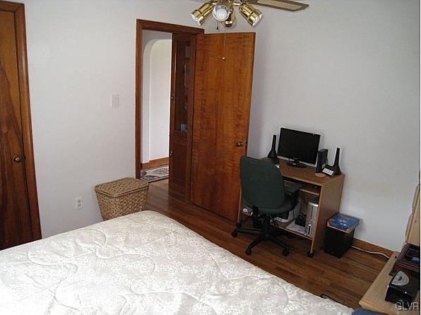 8368 Airport Road Bath, PA 18014 - Photo 7 of 10 a bedroom with a bed and a chair