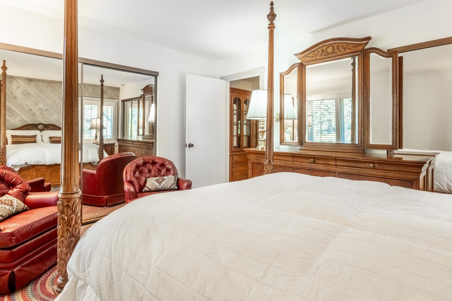 402 Snowcreek Road, Unit 402 Mammoth Lakes, CA 93546 - Photo 18 of 47 a bedroom with bed and a large window