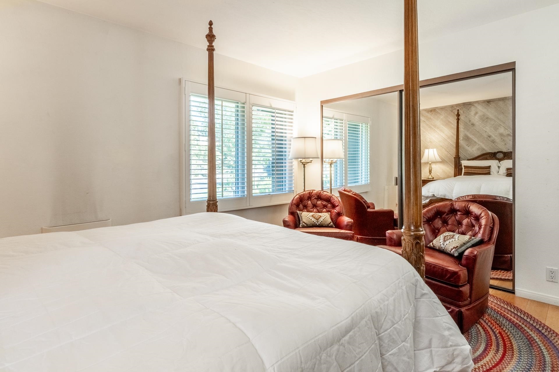 402 Snowcreek Road, Unit 402 Mammoth Lakes, CA 93546 - Photo 19 of 47 a bedroom with bed and glass window