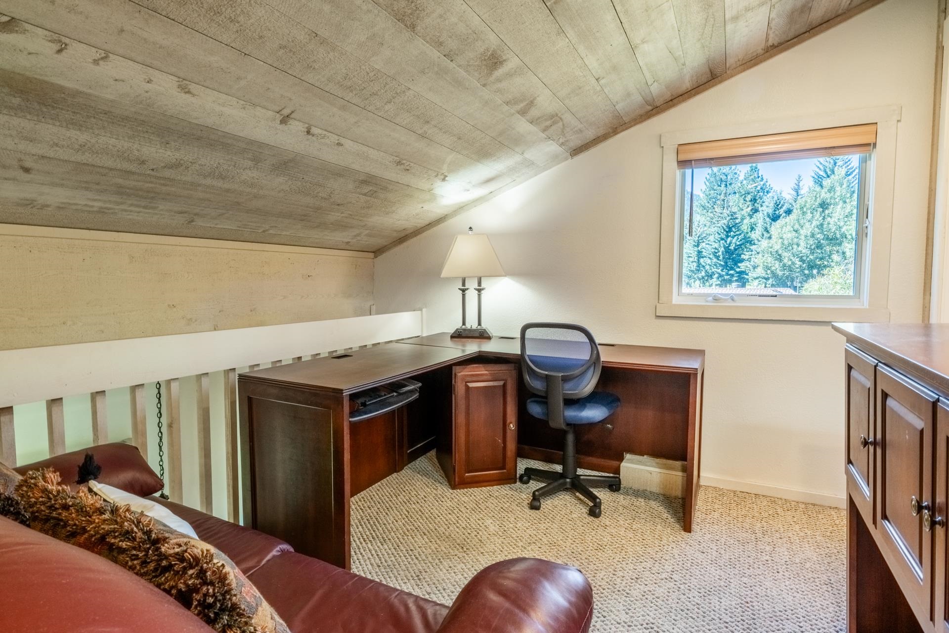 402 Snowcreek Road, Unit 402 Mammoth Lakes, CA 93546 - Photo 25 of 47 a bedroom with furniture and a window