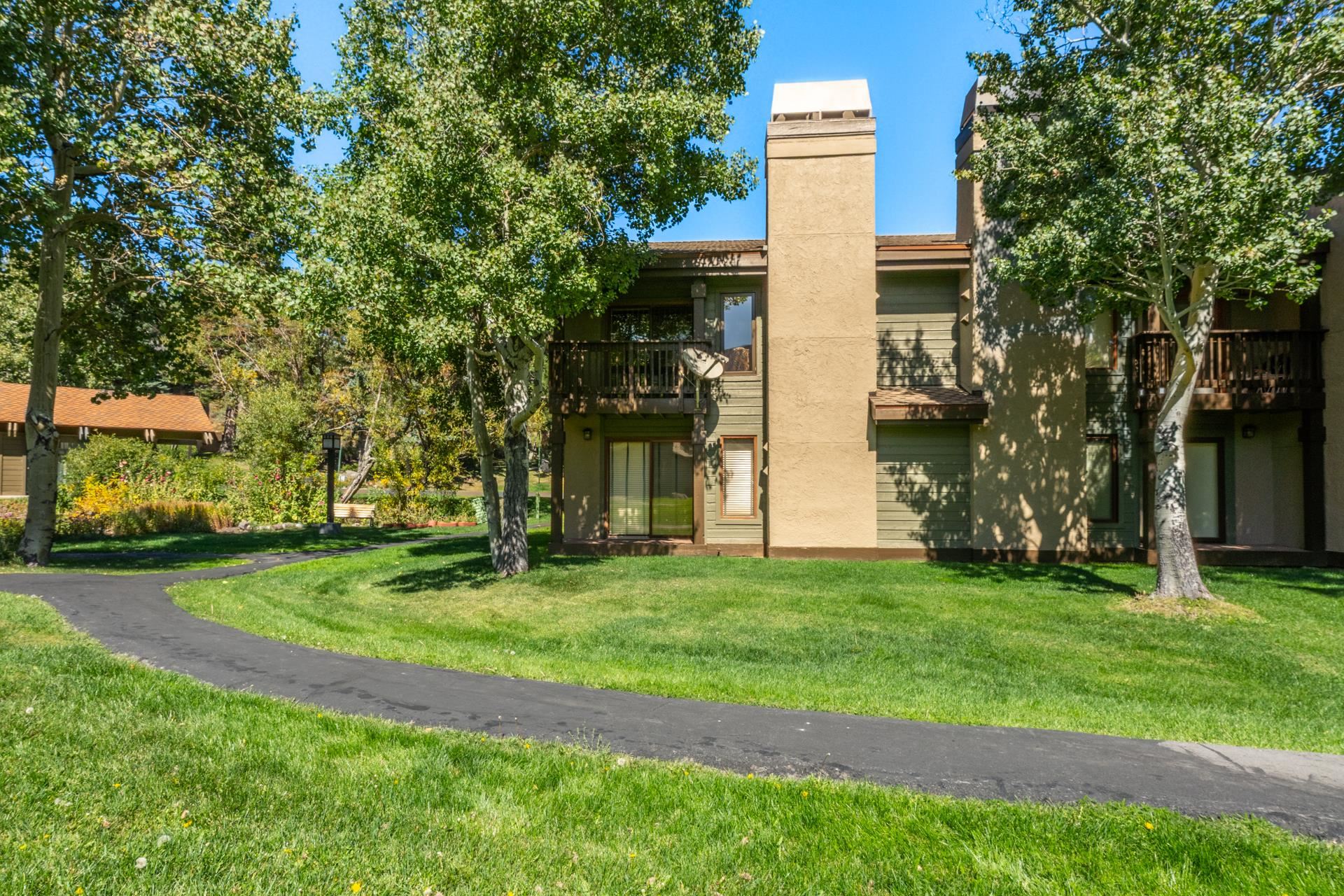 402 Snowcreek Road, Unit 402 Mammoth Lakes, CA 93546 - Photo 37 of 47 a front view of a house with a garden