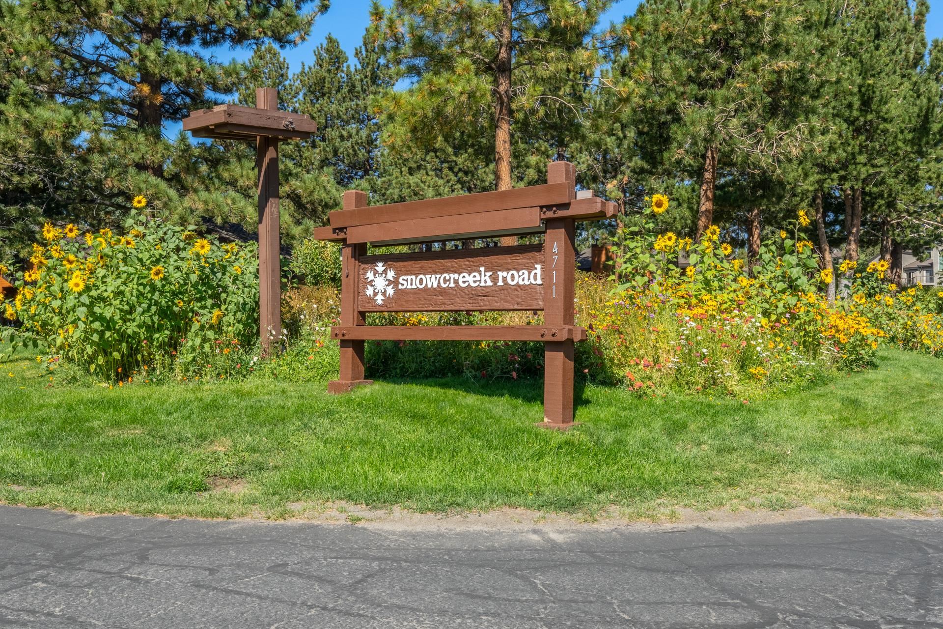 402 Snowcreek Road, Unit 402 Mammoth Lakes, CA 93546 - Photo 46 of 47 a view of outdoor space with a garden and signage