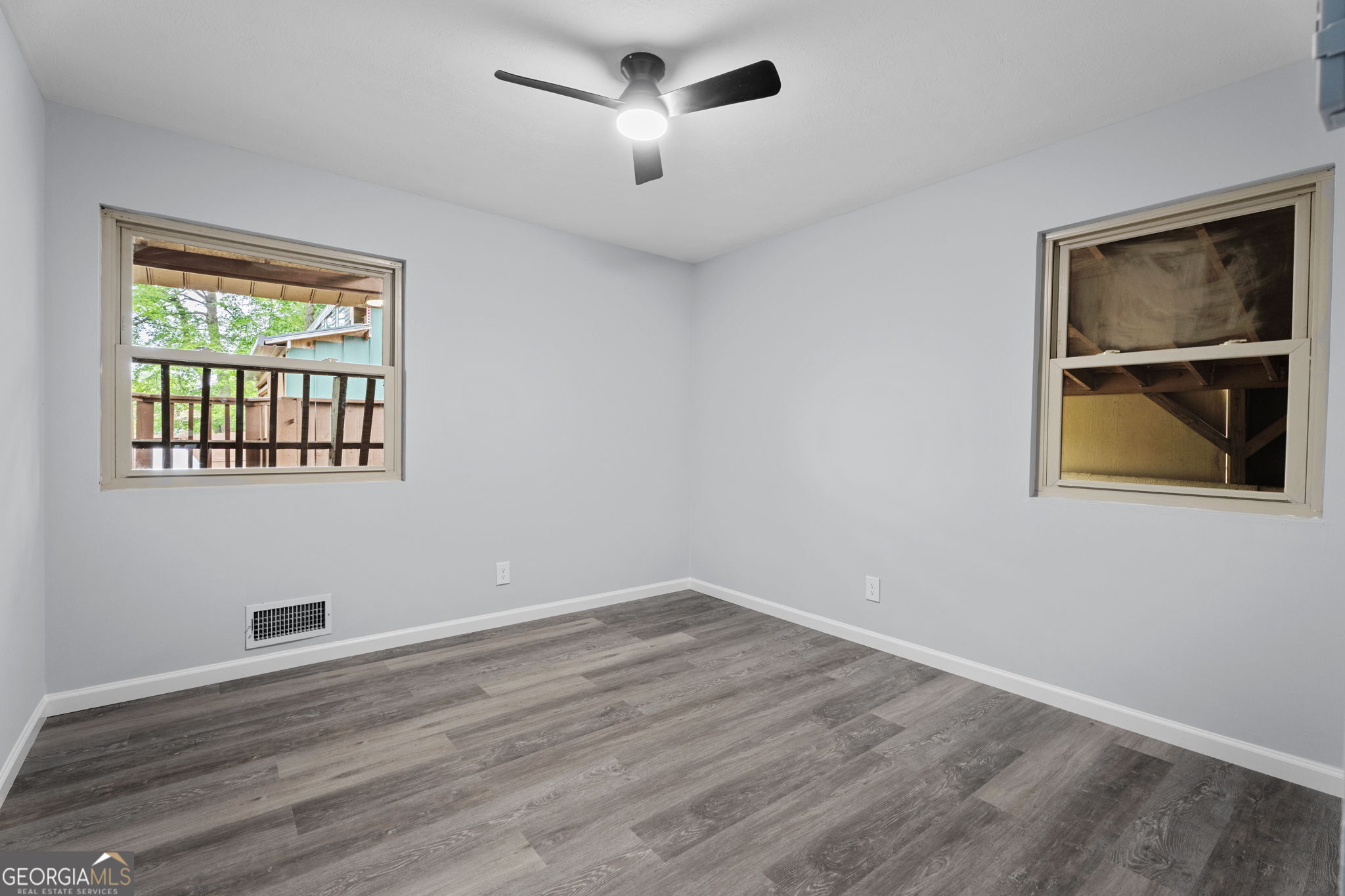 6463 Maddox Road Morrow, GA 30260 - Photo 24 of 46 a view of empty room with wooden floor and fan