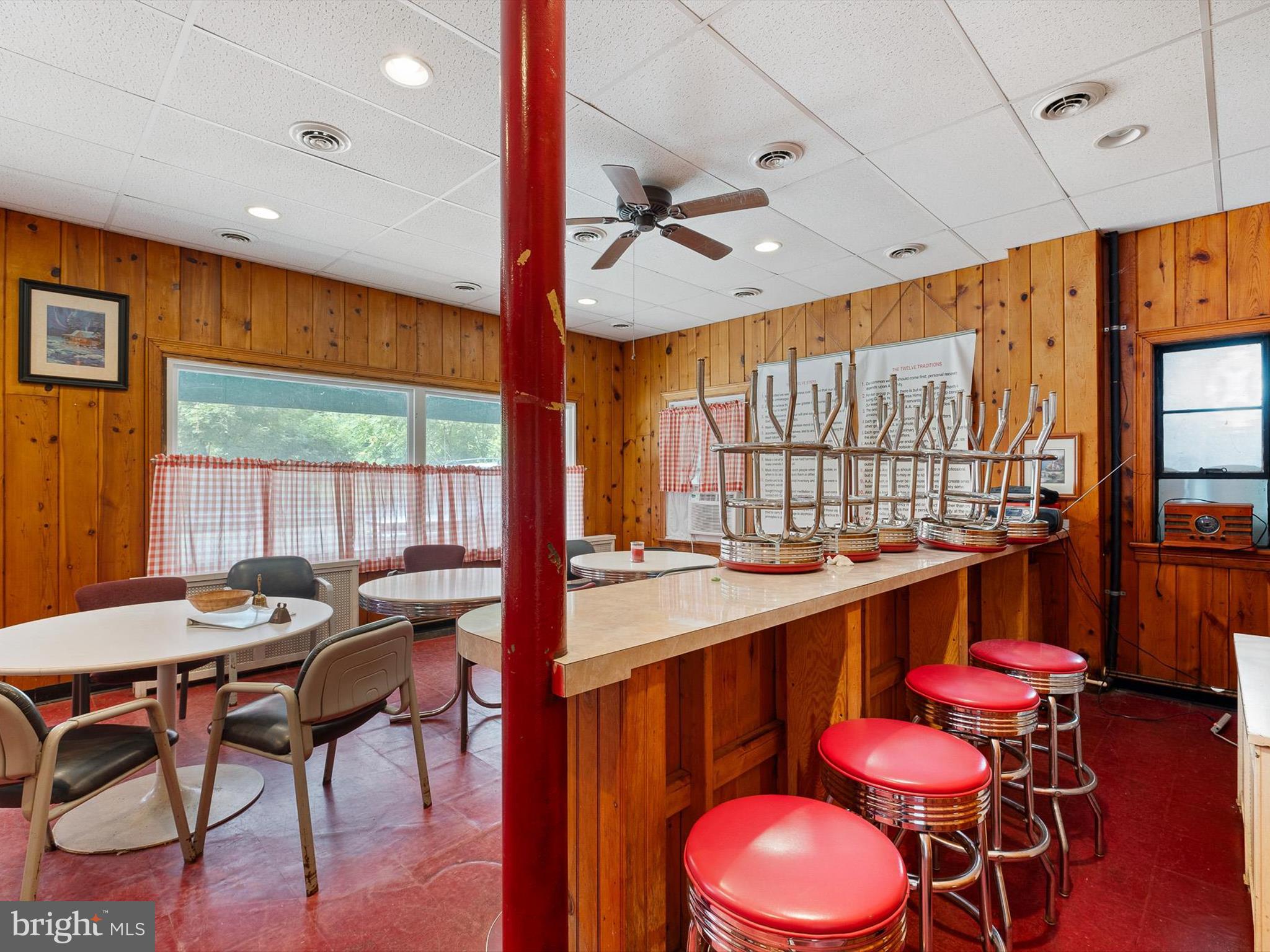 2913 Creek Road Hockessin, DE 19707 - Photo 12 of 39 a kitchen with a table chairs stove and wooden floor