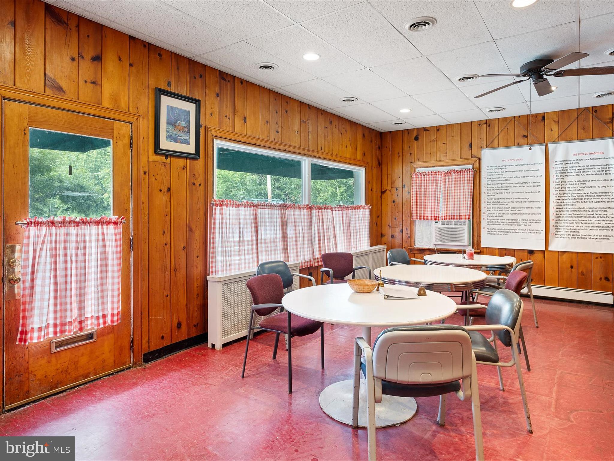 2913 Creek Road Hockessin, DE 19707 - Photo 15 of 39 a dining room with furniture a rug and wooden floor