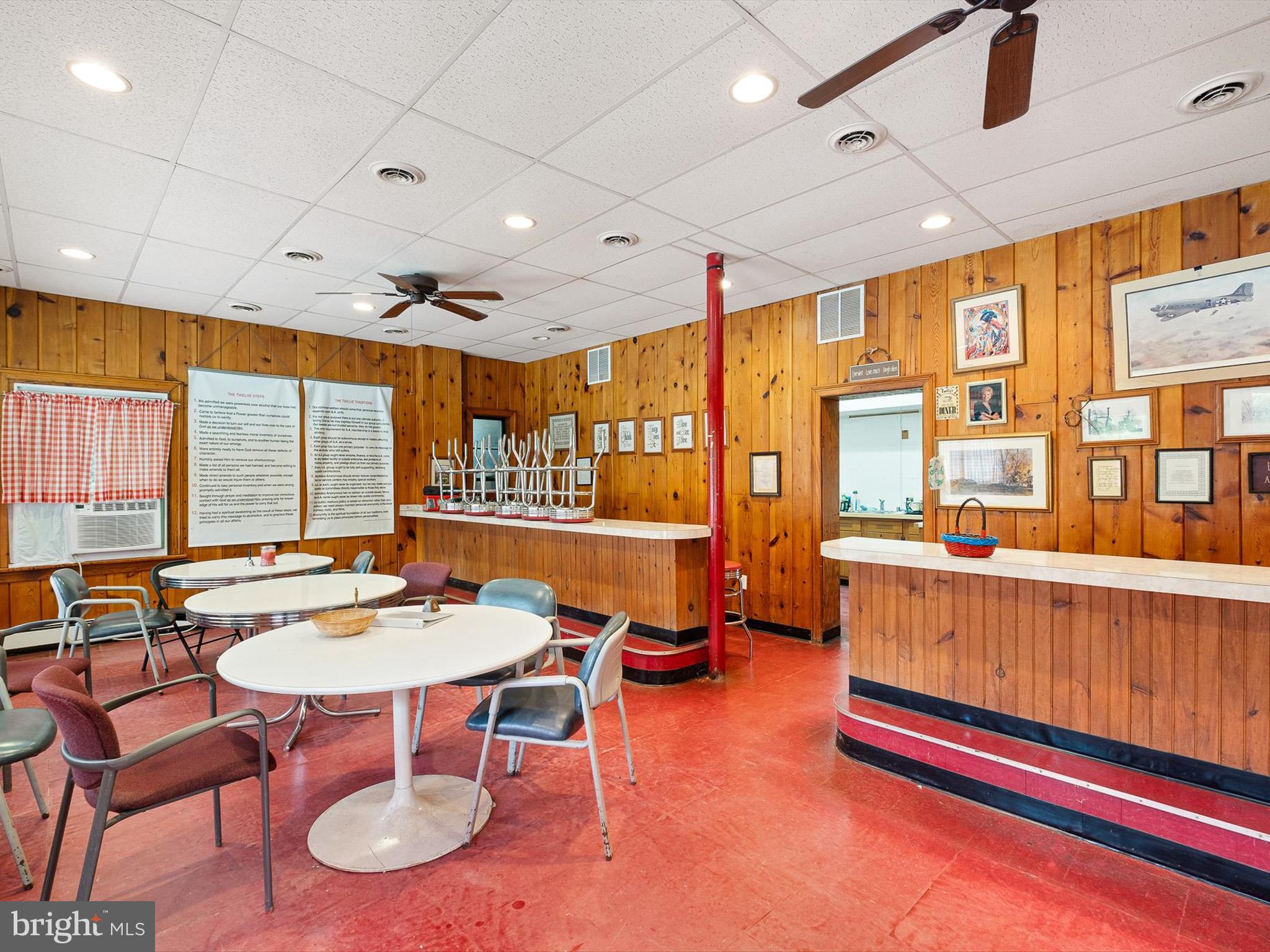 2913 Creek Road Hockessin, DE 19707 - Photo 16 of 39 a living room with furniture a rug and a large window