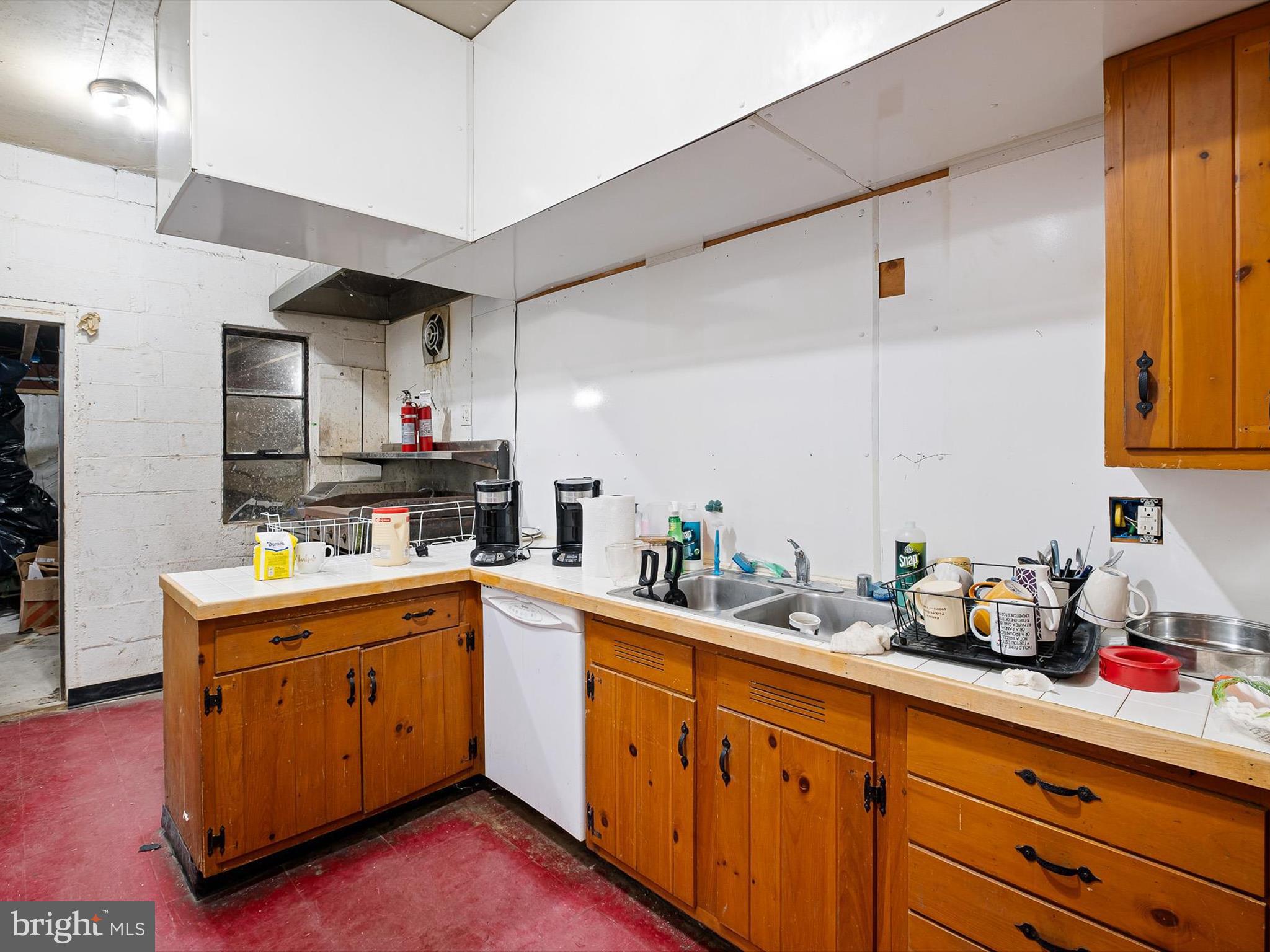 2913 Creek Road Hockessin, DE 19707 - Photo 20 of 39 a kitchen with a sink cabinets and window