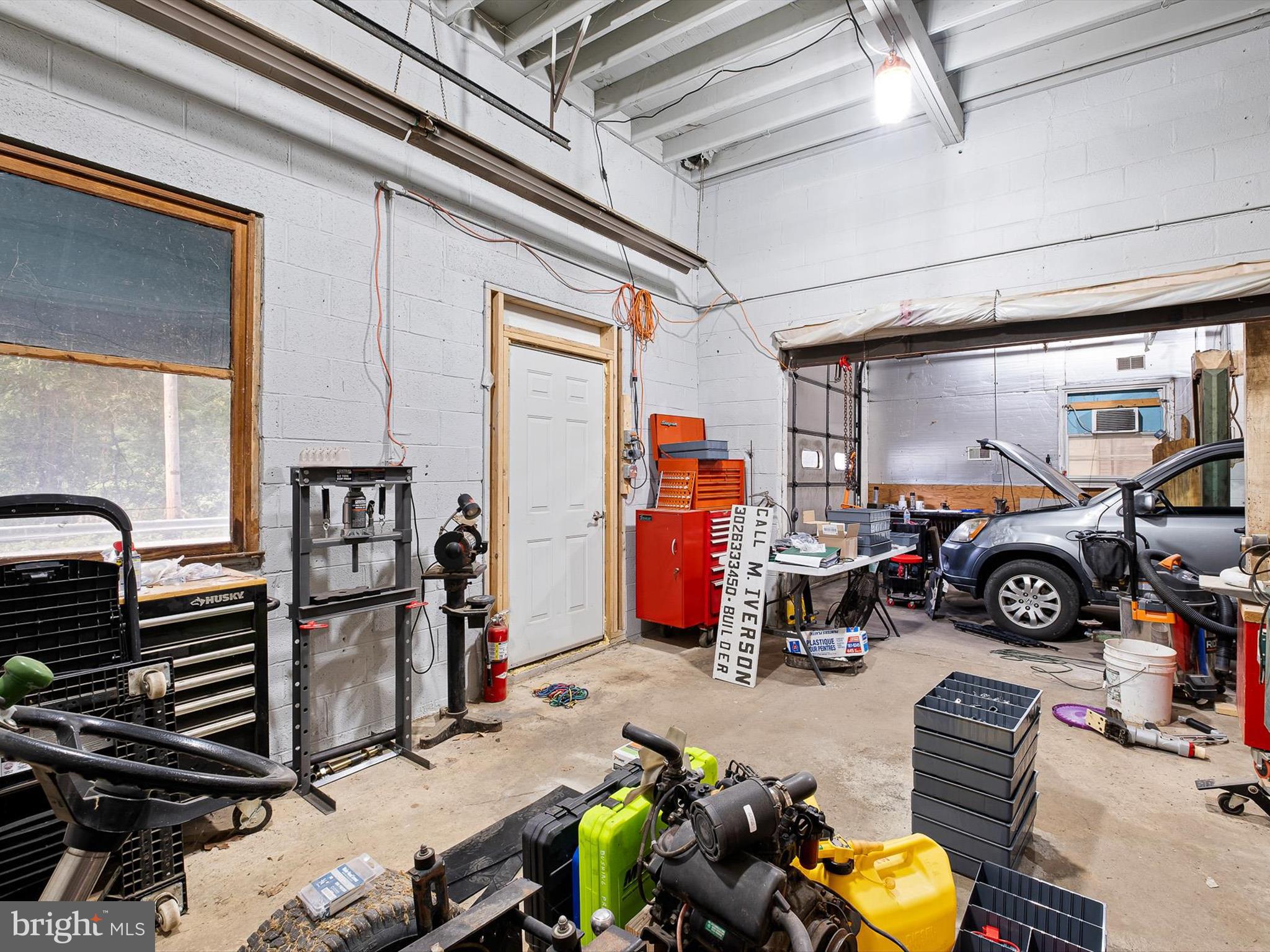 2913 Creek Road Hockessin, DE 19707 - Photo 29 of 39 a view of a garage with stuff
