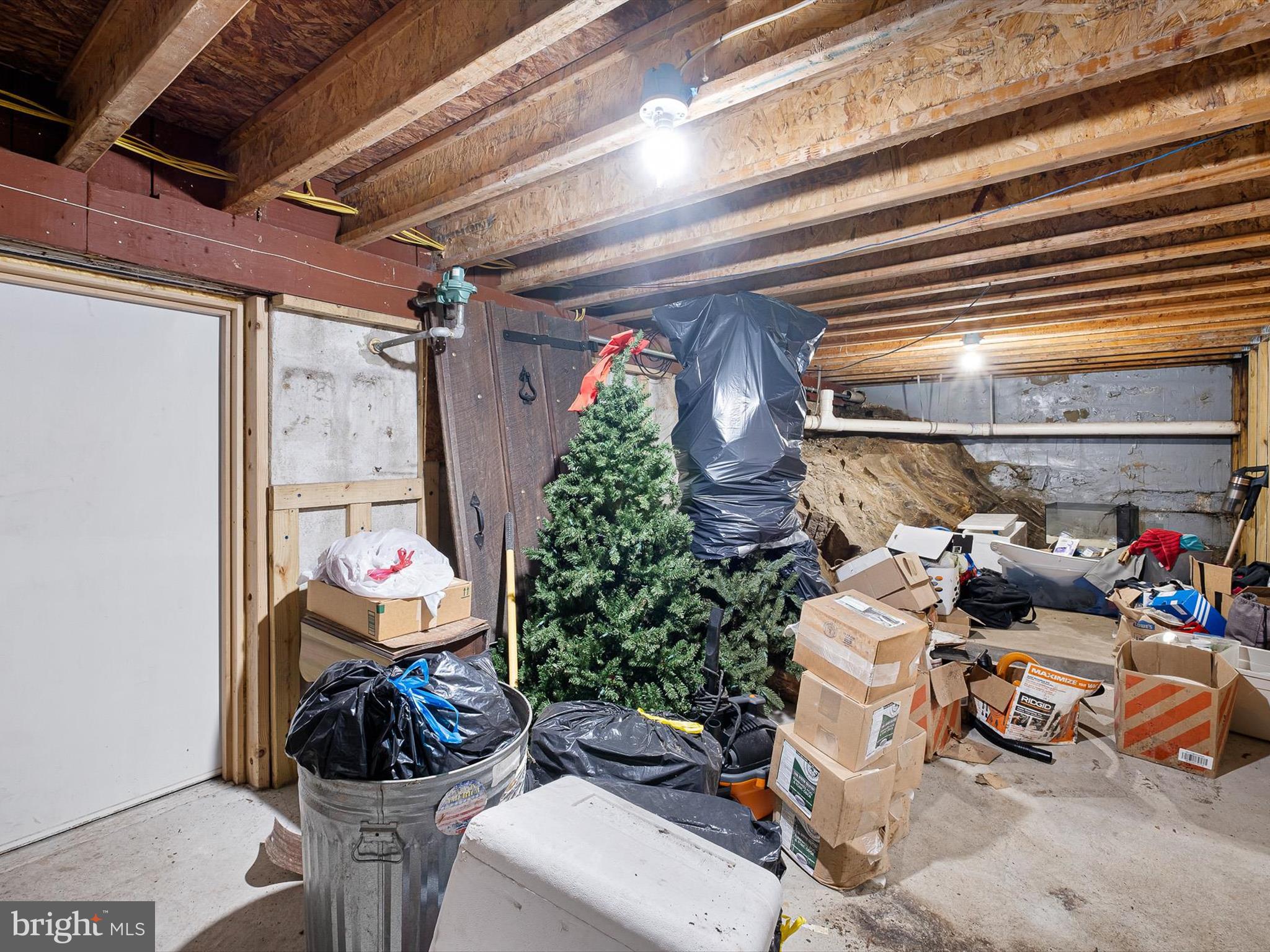2913 Creek Road Hockessin, DE 19707 - Photo 33 of 39 a room with furniture and a garage