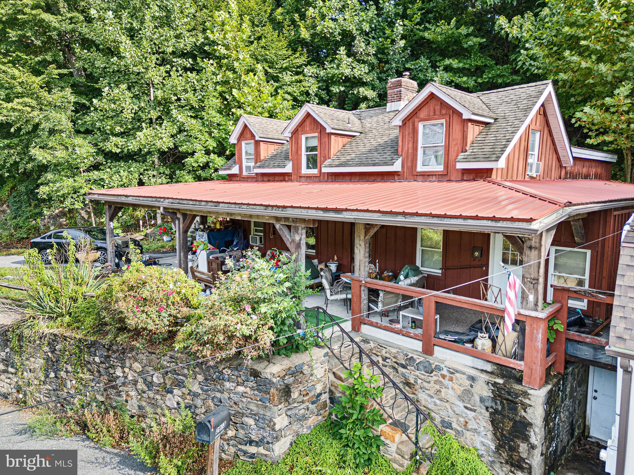 2913 Creek Road Hockessin, DE 19707 - Photo 6 of 39 a front view of a house with garden