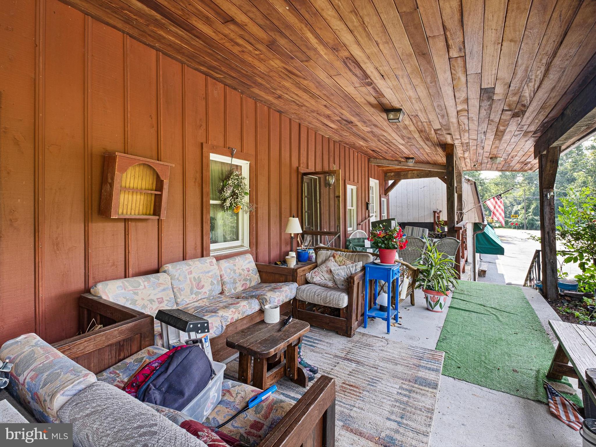 2913 Creek Road Hockessin, DE 19707 - Photo 9 of 39 a living room with furniture and a large window