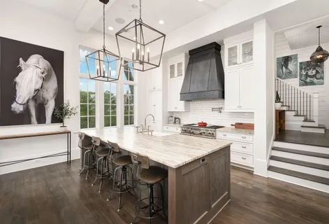 a view of a dining room with furniture large windows and wooden floor