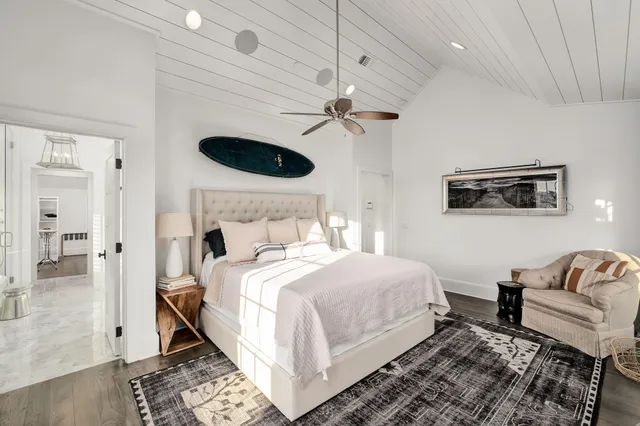 a spacious bathroom with a tub sink and mirror