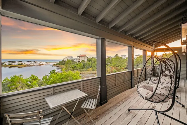 a view of a lake with houses in the back