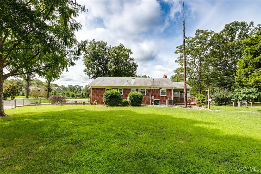9800-9808 Reams Road North Chesterfield, VA 23236 - Photo 11 of 50 a view of a house with a big yard and large trees