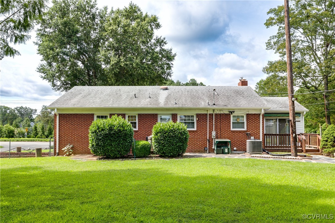 9800-9808 Reams Road North Chesterfield, VA 23236 - Photo 12 of 50 a front view of a house with a garden