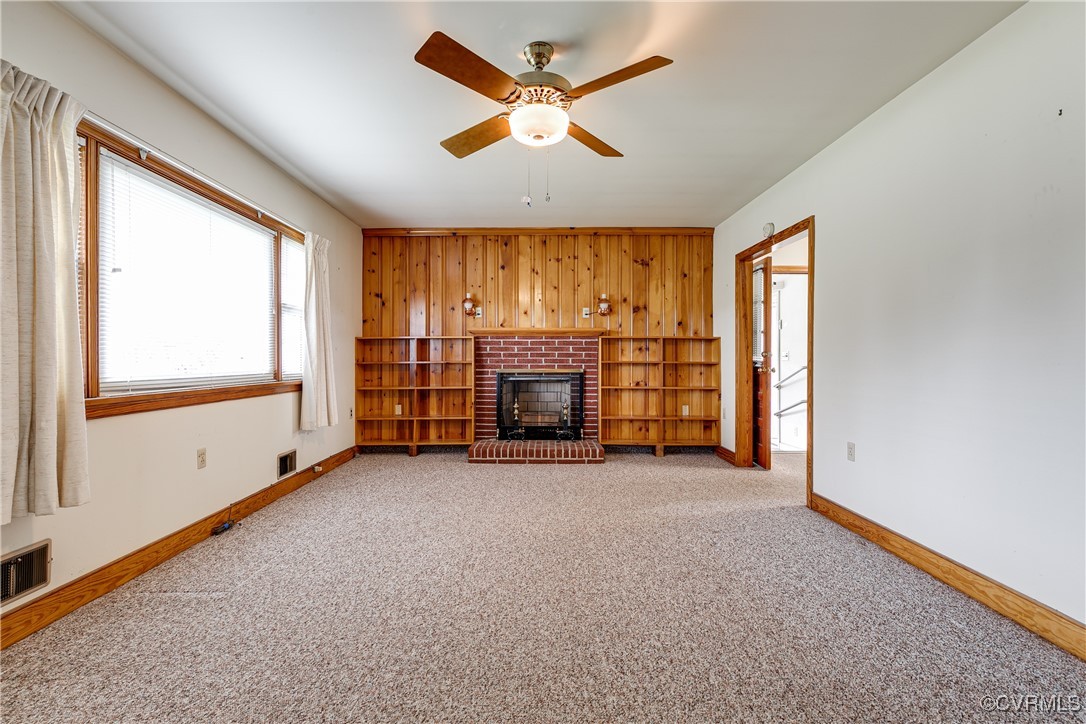9800-9808 Reams Road North Chesterfield, VA 23236 - Photo 17 of 50 an empty room with furniture and a fireplace
