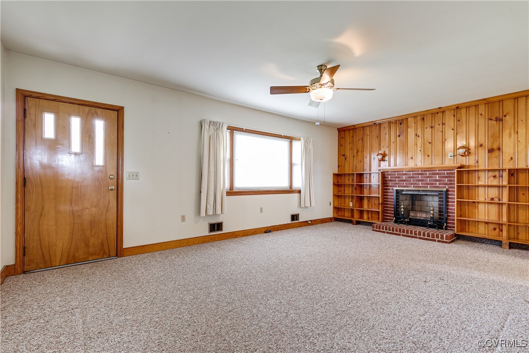 9800-9808 Reams Road North Chesterfield, VA 23236 - Photo 19 of 50 an empty room with furniture fireplace and windows