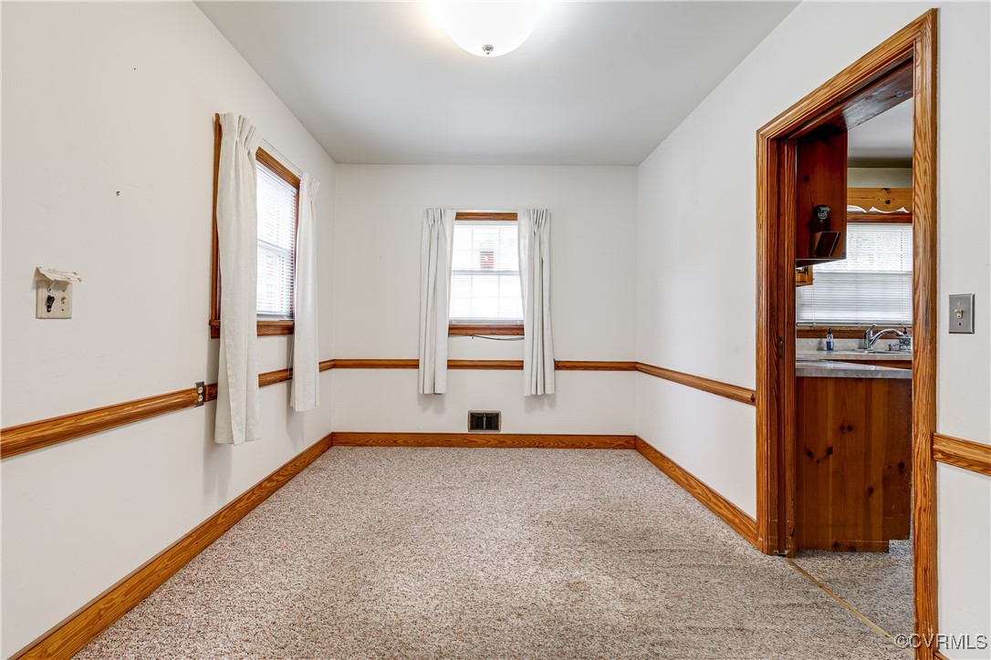 9800-9808 Reams Road North Chesterfield, VA 23236 - Photo 21 of 50 a view of room with window and hardwood floor