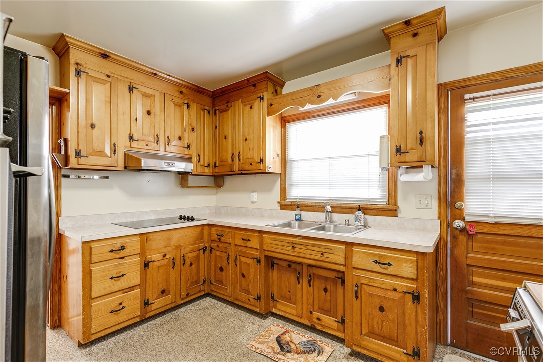 9800-9808 Reams Road North Chesterfield, VA 23236 - Photo 26 of 50 a kitchen with stainless steel appliances granite countertop a sink a stove and cabinets