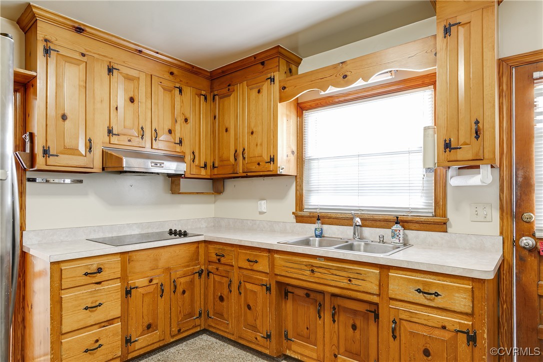 9800-9808 Reams Road North Chesterfield, VA 23236 - Photo 27 of 50 a kitchen with stainless steel appliances granite countertop a sink a stove and cabinets