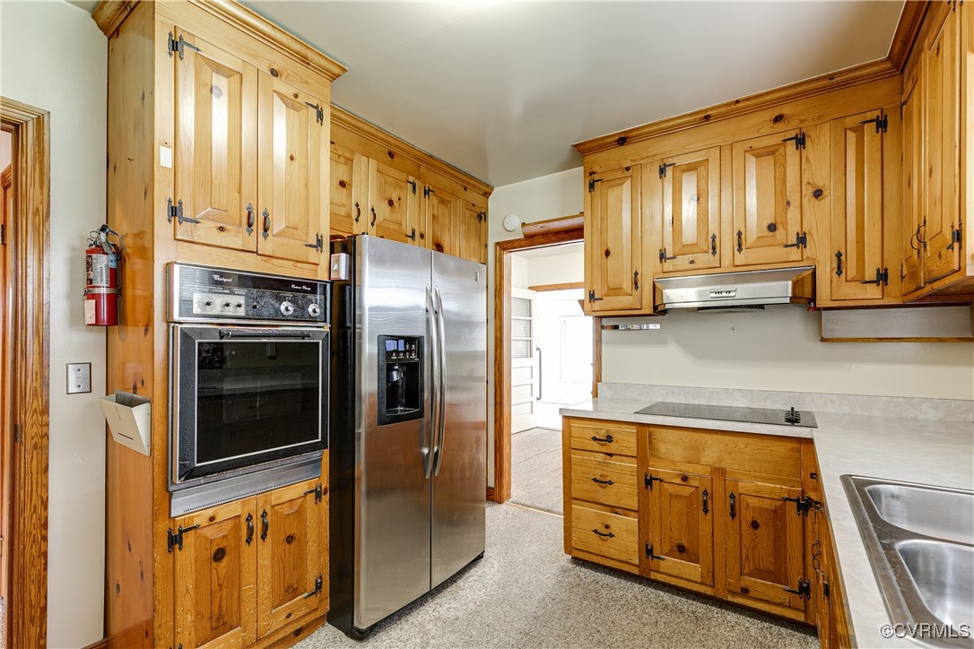 9800-9808 Reams Road North Chesterfield, VA 23236 - Photo 28 of 50 a kitchen with stainless steel appliances granite countertop a refrigerator a stove and a sink