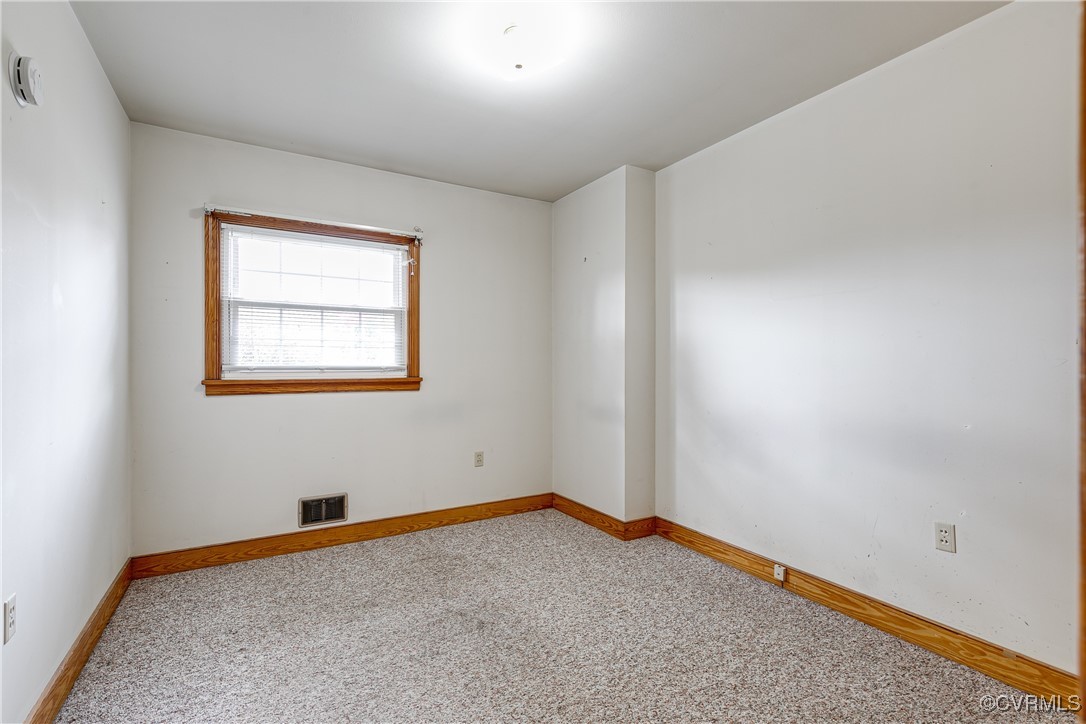 9800-9808 Reams Road North Chesterfield, VA 23236 - Photo 31 of 50 an empty room with a workbench