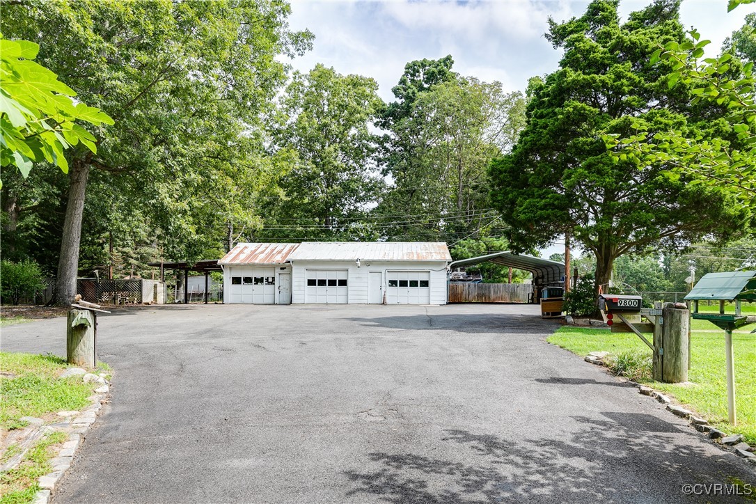 9800-9808 Reams Road North Chesterfield, VA 23236 - Photo 5 of 50 front view of a house with a yard and trees