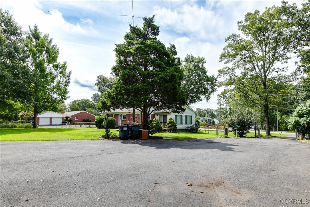 9800-9808 Reams Road North Chesterfield, VA 23236 - Photo 8 of 50 a view of a park with large trees and plants