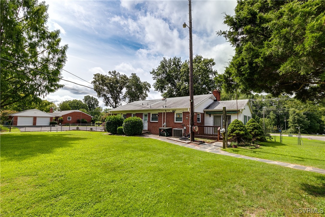 9800-9808 Reams Road North Chesterfield, VA 23236 - Photo 10 of 50 a view of a house with a big yard and large trees