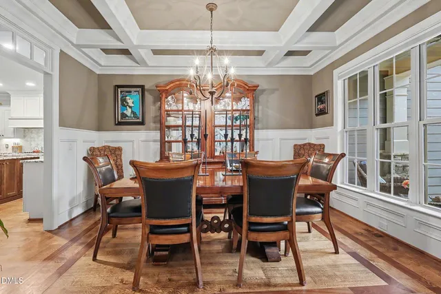 a kitchen with stainless steel appliances granite countertop a sink a stove and cabinets