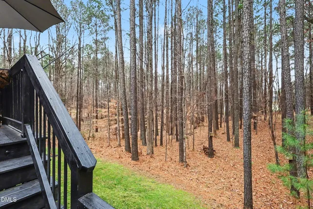 a bathroom with a granite countertop shower two mirror and a sink