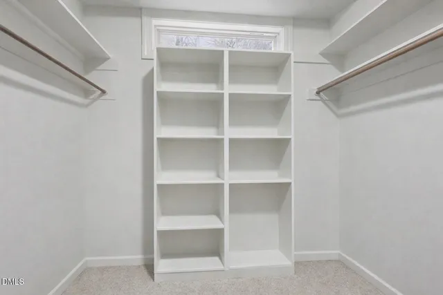 a view of house with backyard and garden