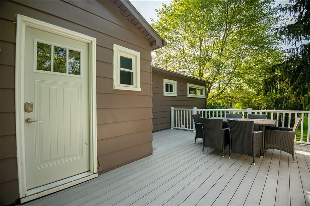 1010 South Keel Ridge Road Hermitage, PA 16148 - Photo 8 of 35 a view of a deck with table and chairs and wooden floor