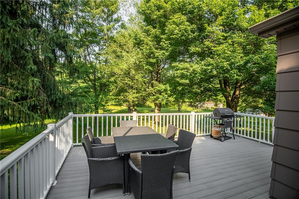 1010 South Keel Ridge Road Hermitage, PA 16148 - Photo 9 of 35 a view of a deck with a table and chairs