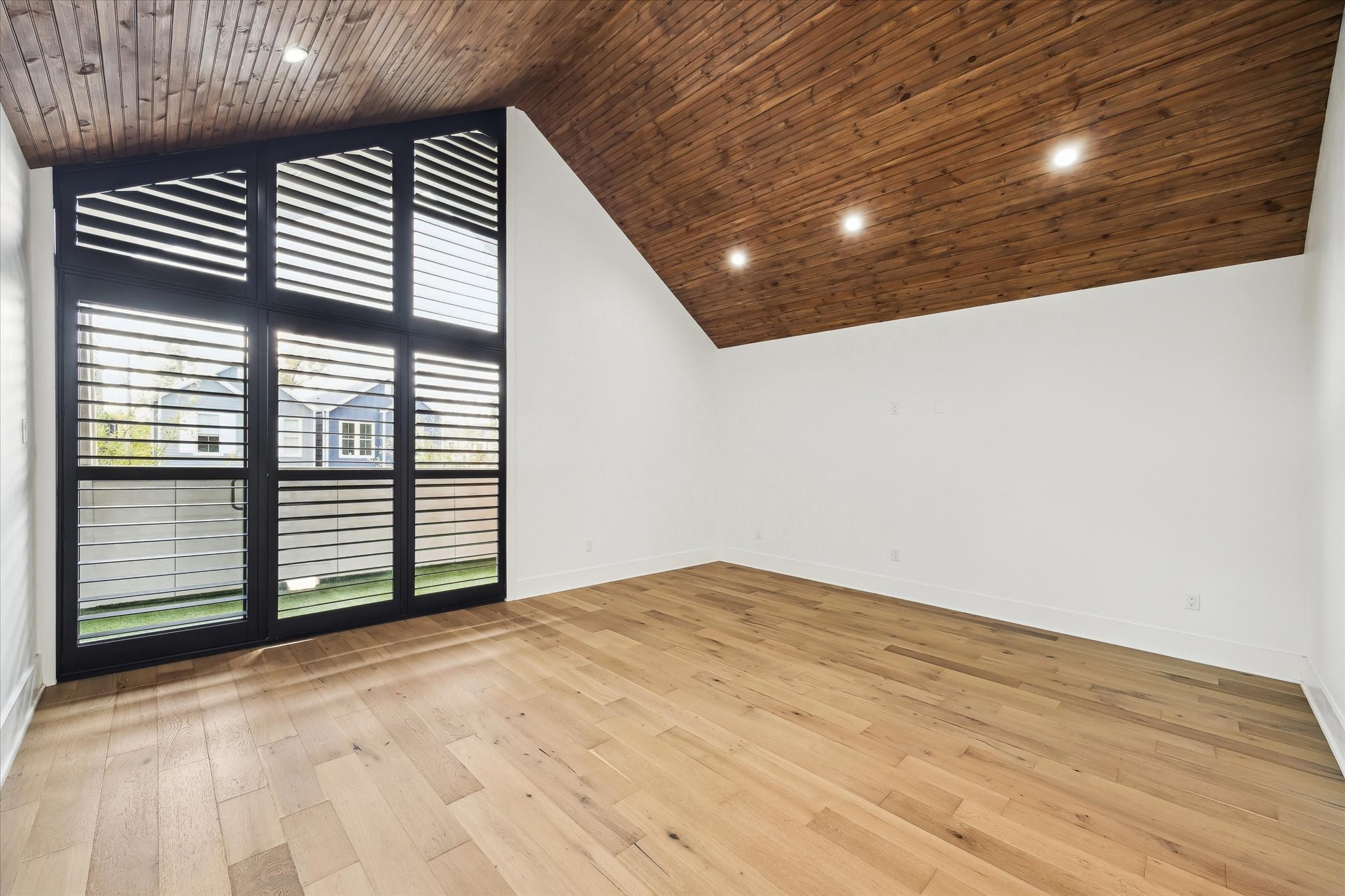 823 Aurora Street Houston, TX 77009 - Photo 10 of 23 Primary bedroom offers a walk out balcony and custom wood shutters