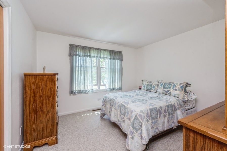 15817 Green Road Harvard, IL 60033 - Photo 11 of 25 a bedroom with a bed and window