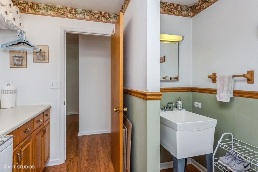 15817 Green Road Harvard, IL 60033 - Photo 16 of 25 a bathroom with a sink a mirror and vanity