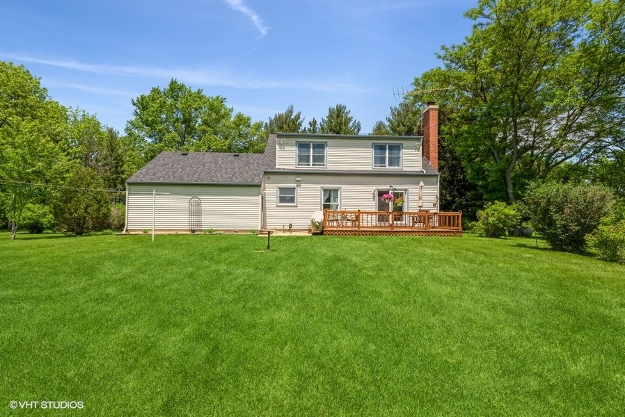 15817 Green Road Harvard, IL 60033 - Photo 19 of 25 a front view of a house with a yard table and chairs