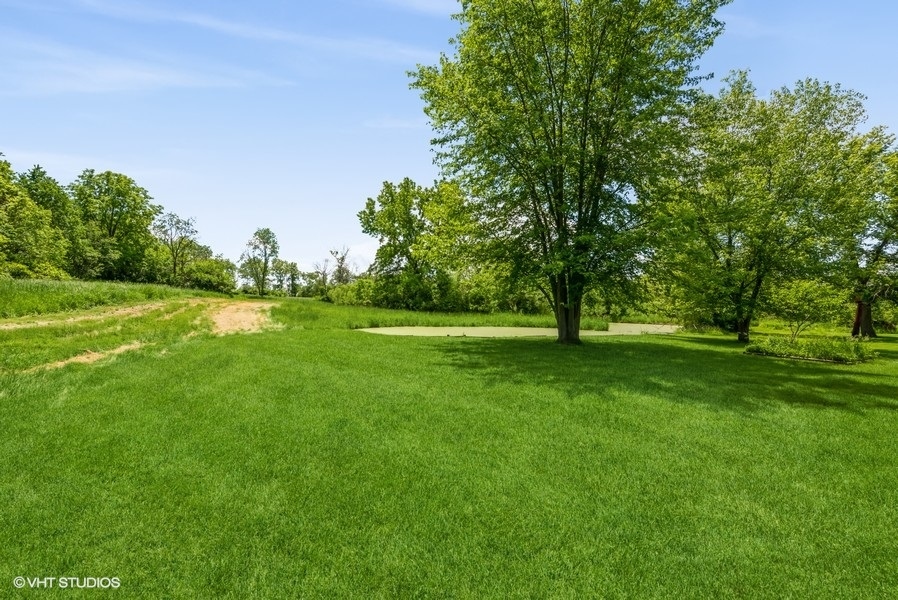 15817 Green Road Harvard, IL 60033 - Photo 21 of 25 a view of grassy field with benches