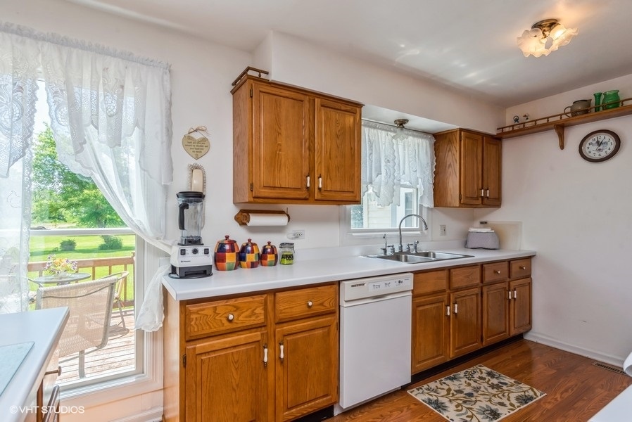 15817 Green Road Harvard, IL 60033 - Photo 4 of 25 a kitchen with a sink cabinets and window