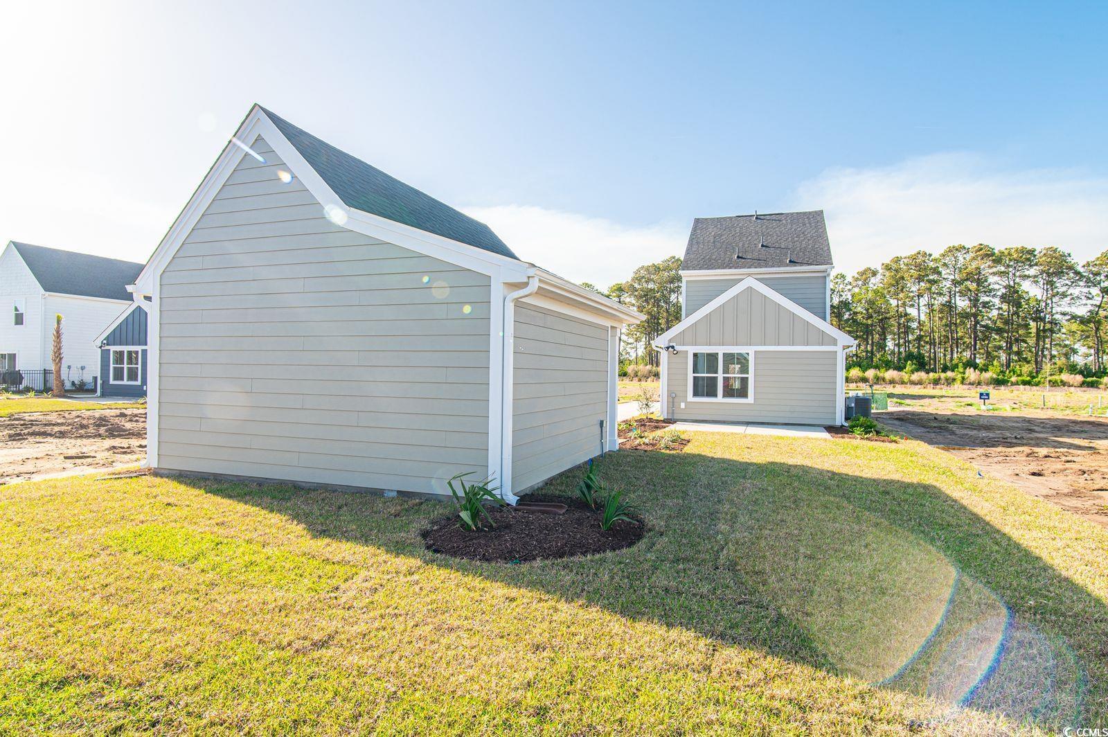 2812 Rowyn Street Longs, SC 29568 - Photo 24 of 27 View of side of home with a yard